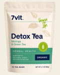 A stand-up pouch of 7vit Detox Tea (Moringa & Green Tea) on a plain white background. The packaging is cream-colored with dark blue text, green accents, and illustrations of leaves.